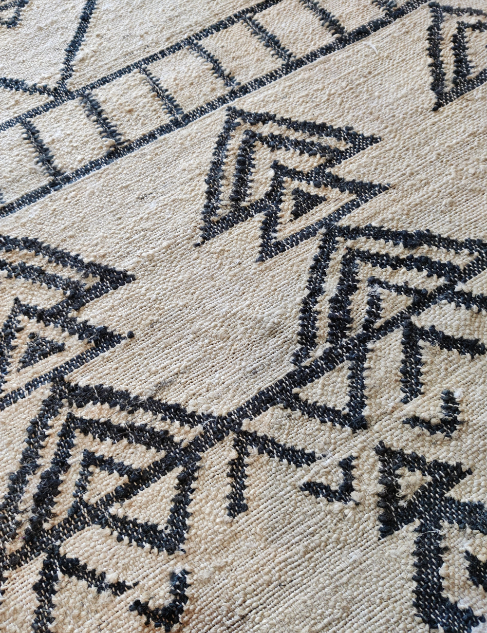 black and natural jute rug