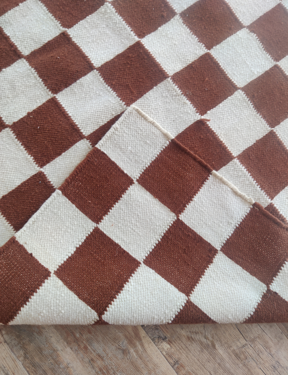 brown and white checkered rug