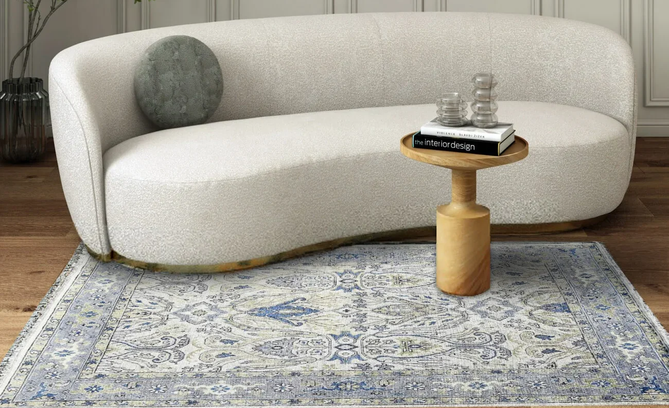 Soft blue Oushak rug with Persian-inspired medallion patterns, enhancing traditional interiors.