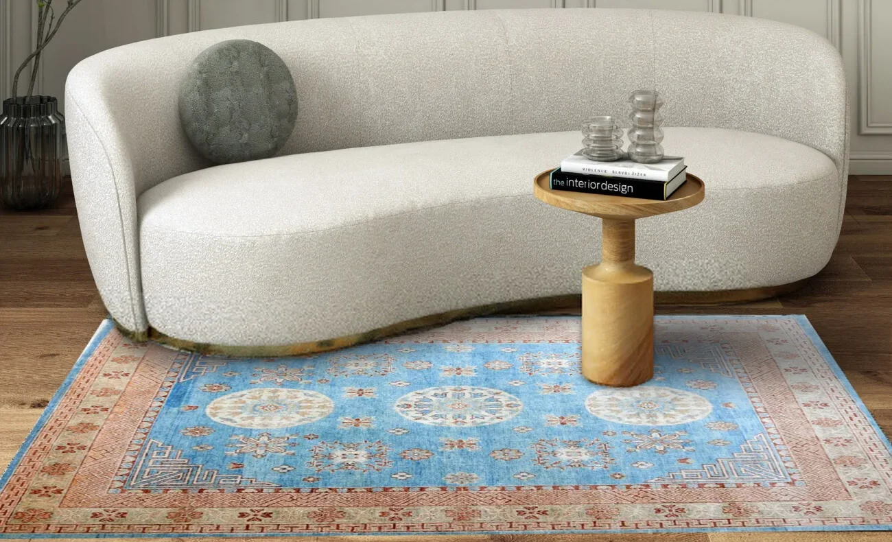 Sky-blue and terracotta Persian Oushak rug in an elegant space.