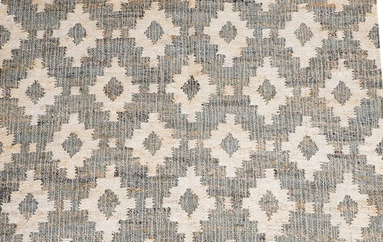 Authentic tribal motif rug with intricate handcrafted details, inspired by ancient designs and rich cultural heritage.