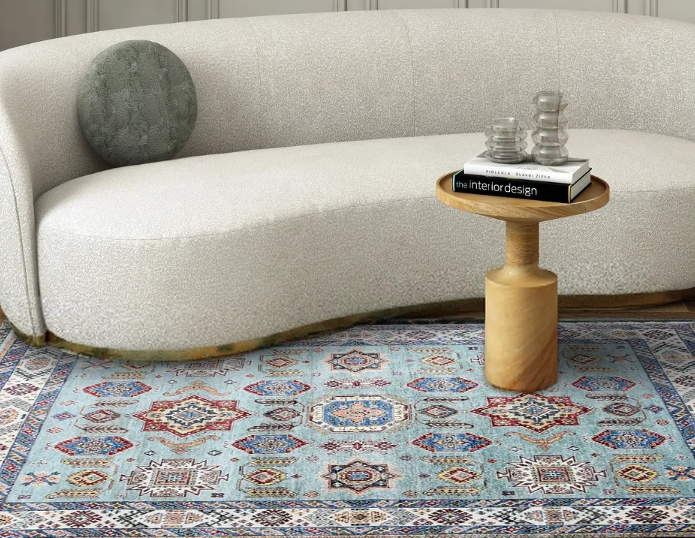 Bright turquoise Oushak rug with multicolor Persian patterns in a modern space.