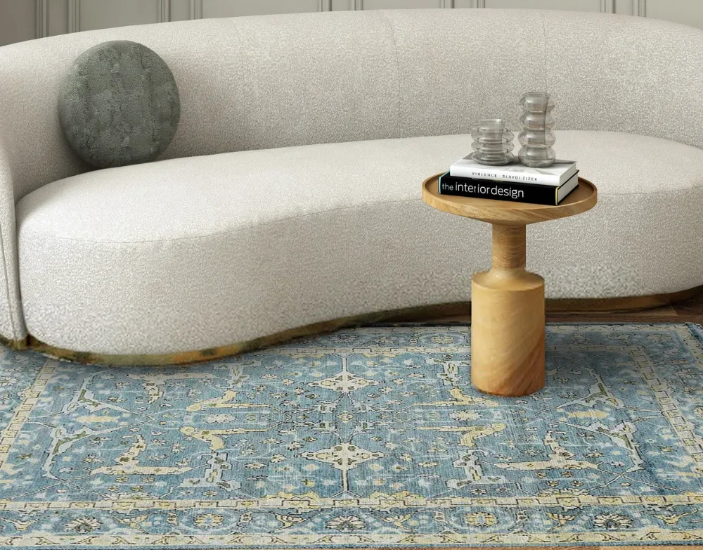 Sky blue and beige Oushak rug with Persian floral motifs in a sophisticated interior.